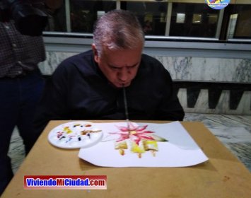 Joel Ramos en el Dia Munidal Pintor Boca y Pie